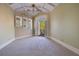 Bright bedroom with neutral decor, a vaulted ceiling, and access to the outdoor balcony at 6324 Deacon Cir, Windermere, FL 34786
