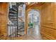 Beautiful spiral staircase and ornate woodwork in a spacious open foyer at 6324 Deacon Cir, Windermere, FL 34786
