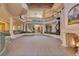 Grand foyer featuring dual staircases, fireplace, soaring ceilings, and exquisite architectural details at 6324 Deacon Cir, Windermere, FL 34786