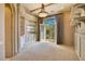 Spacious living room with custom built-ins, a decorative fireplace, and french doors to the patio at 6324 Deacon Cir, Windermere, FL 34786