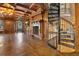 Detailed spiral staircase in this beautiful room with hardwood floors, fireplace and decorative ceilings at 6324 Deacon Cir, Windermere, FL 34786