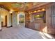 This living room features hardwood trim, a built-in entertainment center, and a doorway into the rest of the home at 6324 Deacon Cir, Windermere, FL 34786