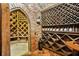 A wine cellar displays wine rack storage with a brick arched doorway at 6324 Deacon Cir, Windermere, FL 34786