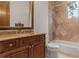 Bathroom featuring a granite-topped vanity, a toilet, and a shower-tub combination with tile surround at 1965 Lake Markham Preserve Trl, Sanford, FL 32771