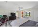 Bedroom featuring a desk, tv and an eat-in kitchen with seating and views of the lake at 1965 Lake Markham Preserve Trl, Sanford, FL 32771