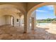 Covered patio with arched walkways and tranquil lake views at 1965 Lake Markham Preserve Trl, Sanford, FL 32771