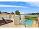 Outdoor patio lounge area overlooking pool and lake at 1965 Lake Markham Preserve Trl, Sanford, FL 32771