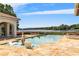 Resort-style pool with lake views and spacious patio at 1965 Lake Markham Preserve Trl, Sanford, FL 32771