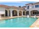 Luxury pool featuring an attached jacuzzi, covered sitting areas, and scenic views at 1965 Lake Markham Preserve Trl, Sanford, FL 32771