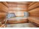 Comfortable wooden sauna featuring benches and cushions, offering a relaxing retreat at 1965 Lake Markham Preserve Trl, Sanford, FL 32771