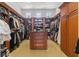 Large walk-in closet with custom shelving, drawers, and ample storage space at 1965 Lake Markham Preserve Trl, Sanford, FL 32771