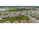 Aerial perspective of a residential area featuring houses and a tranquil lake at 2003 American Beech Pkwy, Ocoee, FL 34761