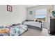 bedroom with twin bed, dresser, and window at 2003 American Beech Pkwy, Ocoee, FL 34761