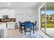 Bright kitchen with island, stainless steel appliances, and white cabinets at 2003 American Beech Pkwy, Ocoee, FL 34761