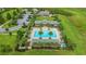 Community pool with lounge chairs and palm trees at 2003 American Beech Pkwy, Ocoee, FL 34761