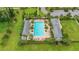 Community pool area with surrounding lush landscaping at 2003 American Beech Pkwy, Ocoee, FL 34761