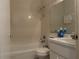 Clean bathroom with a bathtub, toilet, and vanity at 871 Reflections E Loop, Winter Haven, FL 33884