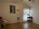 Bedroom with wood floors, window with curtains, and decorative accents at 871 Reflections E Loop, Winter Haven, FL 33884