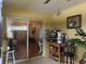 Enclosed patio with view of living room and access to outdoors at 871 Reflections E Loop, Winter Haven, FL 33884