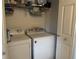 Laundry closet with washer and dryer at 871 Reflections E Loop, Winter Haven, FL 33884