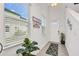 Bright entryway with natural light, tile flooring, and a decorative plant, creating a warm welcome at 15259 Willow Arbor Cir, Orlando, FL 32824