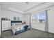 This bedroom has a tray ceiling, carpet floors, two windows, and neutral decor at 15259 Willow Arbor Cir, Orlando, FL 32824