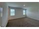 Spacious bedroom with carpet flooring and two windows at 2560 Cavanaugh Dr, Orlando, FL 32817