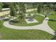 Outdoor community area showcasing picnic tables, lush landscaping, and walkways for residents to enjoy at 2560 Cavanaugh Dr, Orlando, FL 32817
