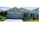 Beautiful single-story home featuring a two-car garage and manicured front lawn at 2560 Cavanaugh Dr, Orlando, FL 32817