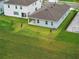 Aerial view of home showcasing backyard with patio and lush landscaping at 2585 Cavanaugh Dr, Orlando, FL 32817