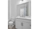 Bathroom with marble countertops, modern sink fixtures, and ample lighting at 2585 Cavanaugh Dr, Orlando, FL 32817