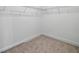 Walk-in closet with wire shelving, neutral walls, and soft carpet at 2585 Cavanaugh Dr, Orlando, FL 32817
