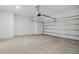 Spacious two car garage with high ceilings, new garage door opener, and white walls at 2585 Cavanaugh Dr, Orlando, FL 32817