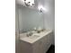 Elegant bathroom with double vanity and large mirror at 816 Johns Point Dr, Oakland, FL 34787