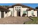 Exterior of a single-story home with paver driveway and landscaping at 816 Johns Point Dr, Oakland, FL 34787