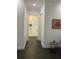 Hallway view featuring dark wood floors, white walls, recessed lighting and bathroom access at 816 Johns Point Dr, Oakland, FL 34787