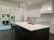 Contemporary kitchen featuring white cabinets, a center island, and stainless appliances at 816 Johns Point Dr, Oakland, FL 34787