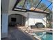 Covered patio with grill, seating area and a pool view at 816 Johns Point Dr, Oakland, FL 34787