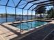 Enclosed pool area with lake view and plenty of sunlight at 816 Johns Point Dr, Oakland, FL 34787