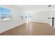 Upstairs loft area with ample natural light, light wood flooring, and views of the neighborhood at 1694 Pinecliff Dr, Apopka, FL 32703