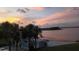 Breathtaking view of a beach cabana near the waterfront, showcasing the sunset views at 4113 Fairview Vista Pt # 308, Orlando, FL 32804