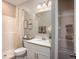 Clean bathroom featuring a shower, white vanity, and storage shelves at 1685 Andover Ridge Dr, Deland, FL 32720