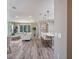 Open concept living room with hardwood floors, bright lighting, and comfortable seating at 1685 Andover Ridge Dr, Deland, FL 32720