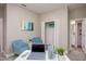 Cozy office space features soft blue chairs, a white desk, and closet space at 1685 Andover Ridge Dr, Deland, FL 32720