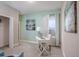 Bright office features soft green walls, white desk, and natural light at 1685 Andover Ridge Dr, Deland, FL 32720