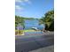 Stunning backyard features a pool, lush lawn, private dock, and serene lake views, creating an ideal outdoor retreat at 1010 Strathmore Dr, Orlando, FL 32806