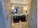 Modern bathroom featuring double vanities, a large mirror, and stylish lighting fixtures at 1010 Strathmore Dr, Orlando, FL 32806