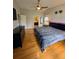 Bright bedroom with a view into the bathroom, natural light, and hardwood floors at 1010 Strathmore Dr, Orlando, FL 32806