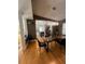 Open dining room area with modern light fixture, with views to kitchen at 1010 Strathmore Dr, Orlando, FL 32806