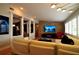 Open living room with stone accent wall, a sleek media center, and elegant lighting at 1010 Strathmore Dr, Orlando, FL 32806